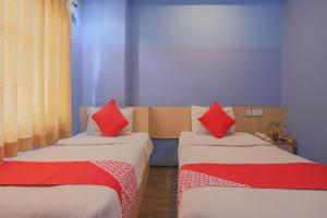 Voodi või voodid majutusasutuse OYO 789 Hotel Shivam Plaza toas