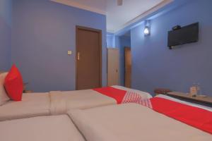 Voodi või voodid majutusasutuse OYO 789 Hotel Shivam Plaza toas