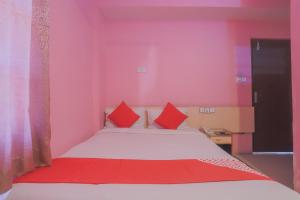 Voodi või voodid majutusasutuse OYO 789 Hotel Shivam Plaza toas