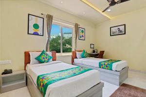 Letto o letti in una camera di Treebo Moon Waalk, Patia