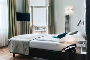 Postel nebo postele na pokoji v ubytování Best Western Hotel Kurfürst Wilhelm I.