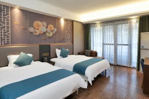 Xizha River View Homestay客房内的一张或多张床位
