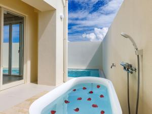 a bathroom with a tub with a view of the ocean at ResortVilla-KAPUKA in Kouri +111 photos