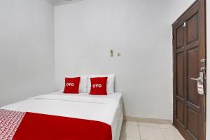 Postel nebo postele na pokoji v ubytování OYO 91082 Nathania Exclusive