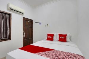 Postel nebo postele na pokoji v ubytování OYO 91082 Nathania Exclusive + 19 fotografií