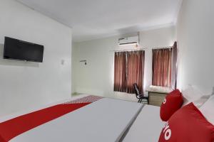 Postel nebo postele na pokoji v ubytování OYO 91082 Nathania Exclusive