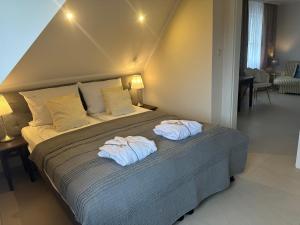 Postel nebo postele na pokoji v ubytování Villa TAAN Royal