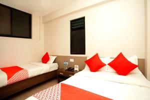 Voodi või voodid majutusasutuse OYO 626 Hotel Himchuli toas