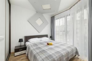 Posteľ alebo postele v izbe v ubytovaní Apartamenty Horyzont SeaView by Rent like home
