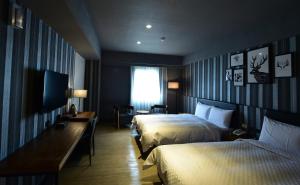 Voodi või voodid majutusasutuse Fulidun Hotel Kenting toas