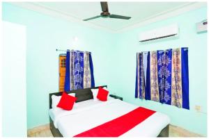 Voodi või voodid majutusasutuse Hotel Bhubaneswar MADISON INN PATIA toas