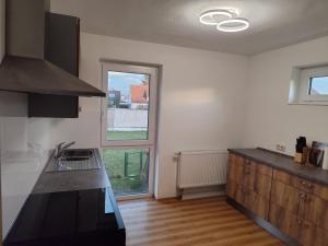 a kitchen with a sink and a counter top at FeWo Wellfit in Bad Buchau