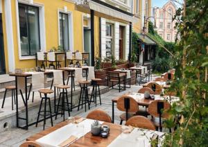 a group of tables and chairs on a patio at Varna Moreto in Varna City