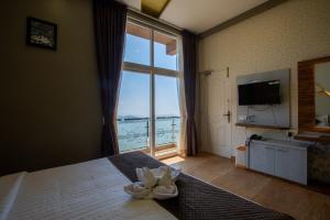 Ένα ή περισσότερα κρεβάτια σε δωμάτιο στο Paradise Point Ooty