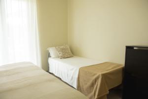 Postel nebo postele na pokoji v ubytování Residenze Roscioli