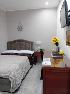Postel nebo postele na pokoji v ubytování Al Punto Giusto