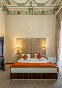 Postel nebo postele na pokoji v ubytování Garden Inn by NHG