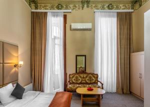 Postel nebo postele na pokoji v ubytování Garden Inn by NHG