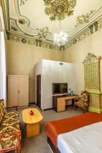 Postel nebo postele na pokoji v ubytování Garden Inn by NHG