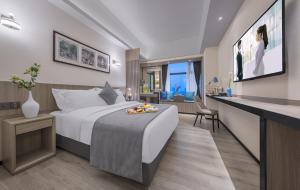Postel nebo postele na pokoji v ubytování Foshan Shunde Ruitao Hotel