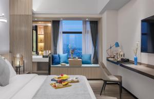 Postel nebo postele na pokoji v ubytování Foshan Shunde Ruitao Hotel