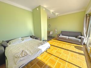 Кровать или кровати в номере PROMENADE HOLIDAY - SUFFREN BEACH