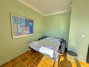 Кровать или кровати в номере PROMENADE HOLIDAY - SUFFREN BEACH