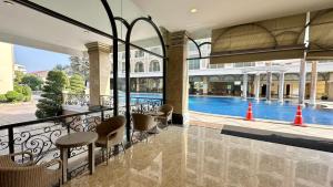 a view of a swimming pool from a hotel lobby at LK CRYSTAL Ville Pattaya in Pattaya South
