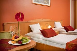 Posteľ alebo postele v izbe v ubytovaní Hotel Kálvária