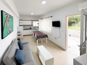 a living room with a couch and a table at Filio's home in Zárakes