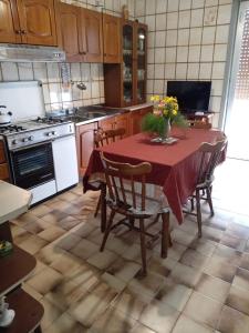 Kuchyň nebo kuchyňský kout v ubytování Il Corbezzolo Appartamenti