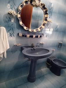 Koupelna v ubytování Il Corbezzolo Appartamenti + 11 fotografií