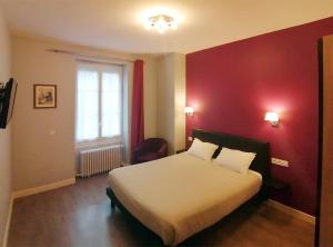 Postel nebo postele na pokoji v ubytování Hôtel Le Dormeux