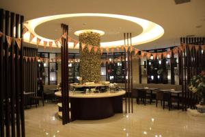 Restaurace v ubytování Baolong Homelike Hotel Shanghai - Changxing Branch