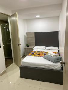 Postel nebo postele na pokoji v ubytování Hotel Ciento Once Boutique Laureles
