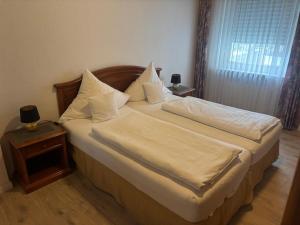 Postel nebo postele na pokoji v ubytování Hotel Mietz