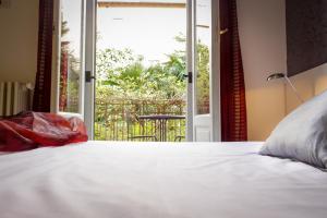 Postel nebo postele na pokoji v ubytování Hotel RossoVino Milano