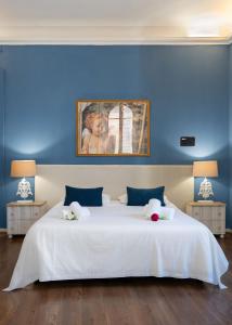 Ένα ή περισσότερα κρεβάτια σε δωμάτιο στο Keys of Italy - Speziali 1 - Deluxe 2 bedroom flat nearby Piazza Repubblica