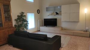TV a/nebo společenská místnost v ubytování Residence La Mason