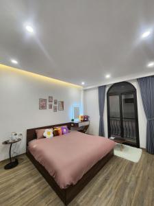 Ένα ή περισσότερα κρεβάτια σε δωμάτιο στο Secret Homestay