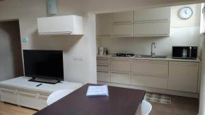 Kuchyň nebo kuchyňský kout v ubytování Residence La Mason