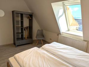 Katil atau katil-katil dalam bilik di Ferienwohnung Marktblick