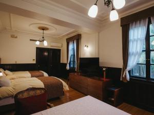 Postel nebo postele na pokoji v ubytování Kurokawa-So