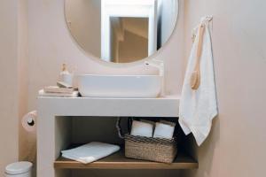 a bathroom with a sink and a mirror at Ona Boutique Apartments in Hanioti +31 photos