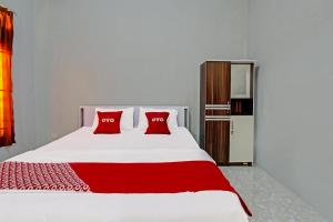 Postel nebo postele na pokoji v ubytování OYO 91210 Hotel J3