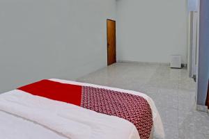 Postel nebo postele na pokoji v ubytování OYO 91210 Hotel J3
