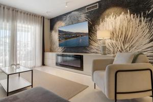 TV a/nebo společenská místnost v ubytování Espacioso y encantador apartamento en las gaviotas