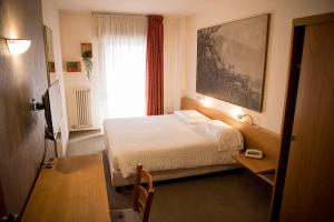A bed or beds in a room at Hotel Rendez Vous