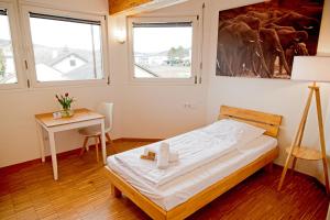 Ein Bett oder Betten in einem Zimmer der Unterkunft Boardinghouse Steinen