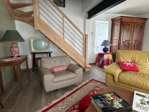 Et opholdsområde på La petite maison des MADELEINE de GIEVRES